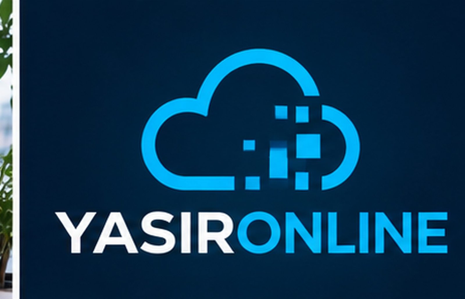 The YasirOnline cloud logo and wordmark displayed on the agency office wall